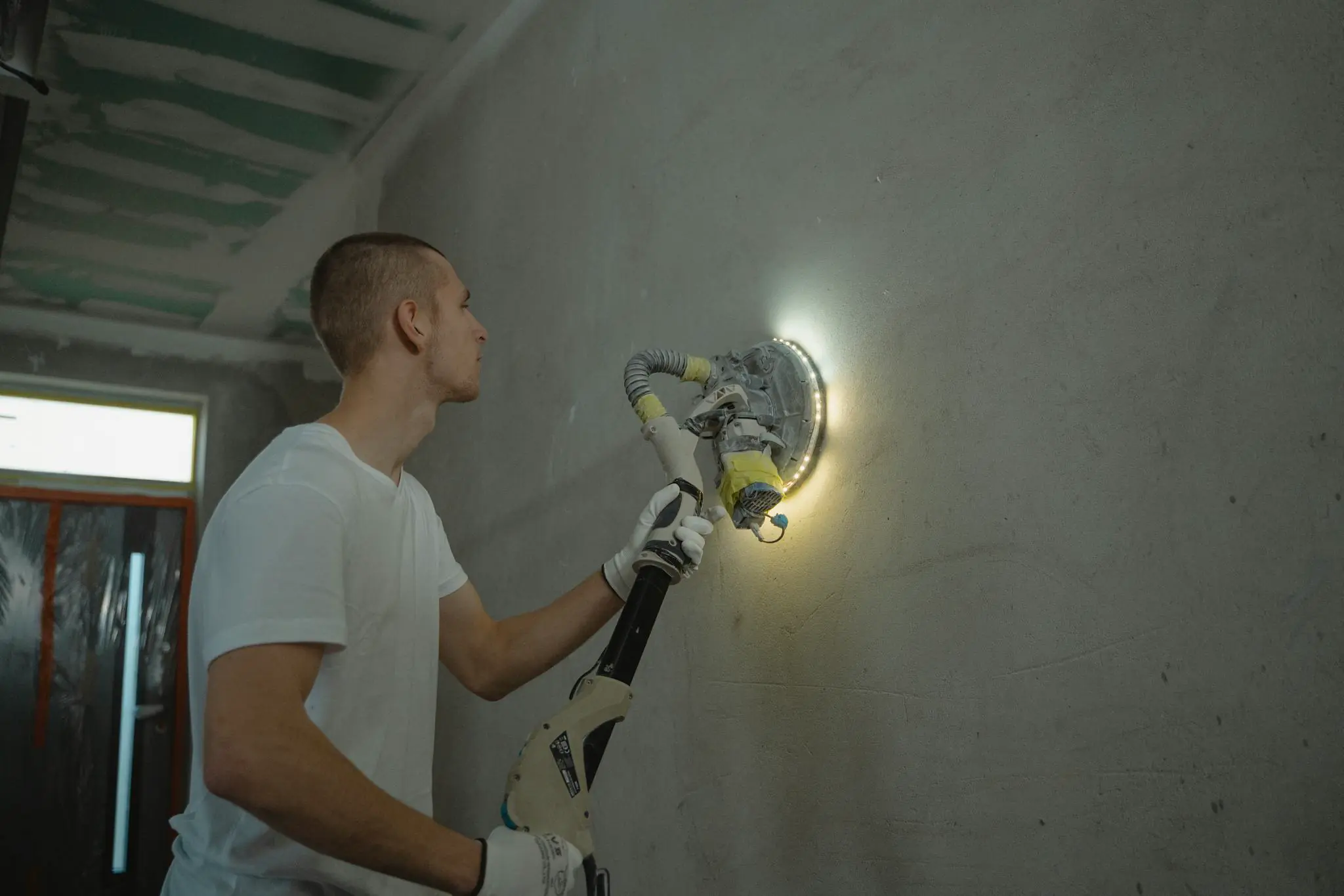 Skilled worker using a power tool during a Kentucky commercial construction project